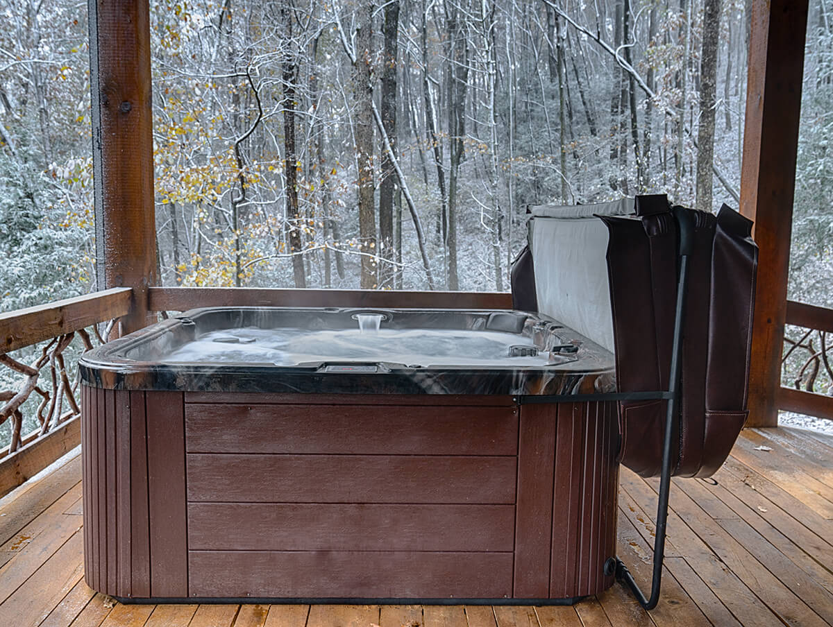 Outdoor Hot tub on a cabin deck in the winter