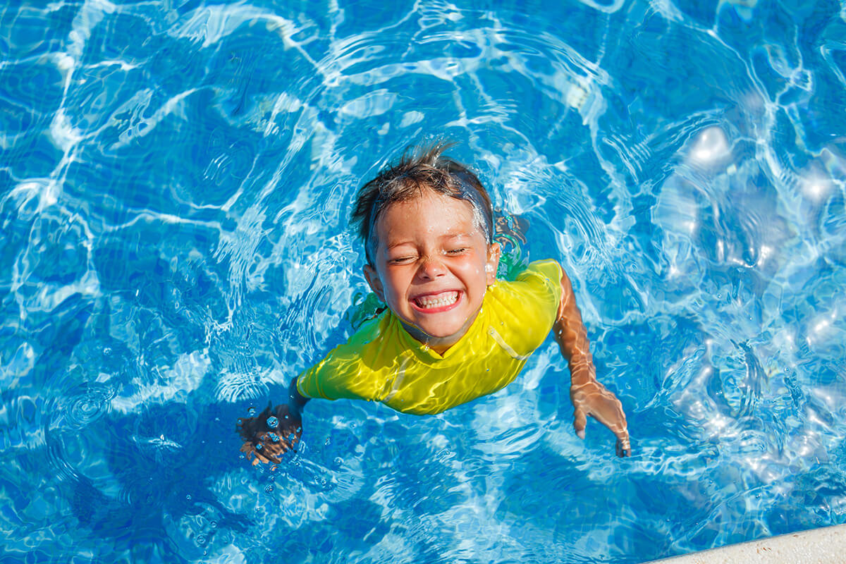 Boy swimming in the pool
