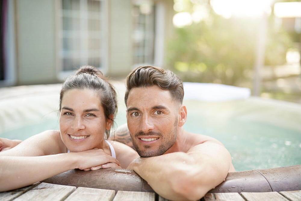 Couple enjoying relaxing time in jacuzzi