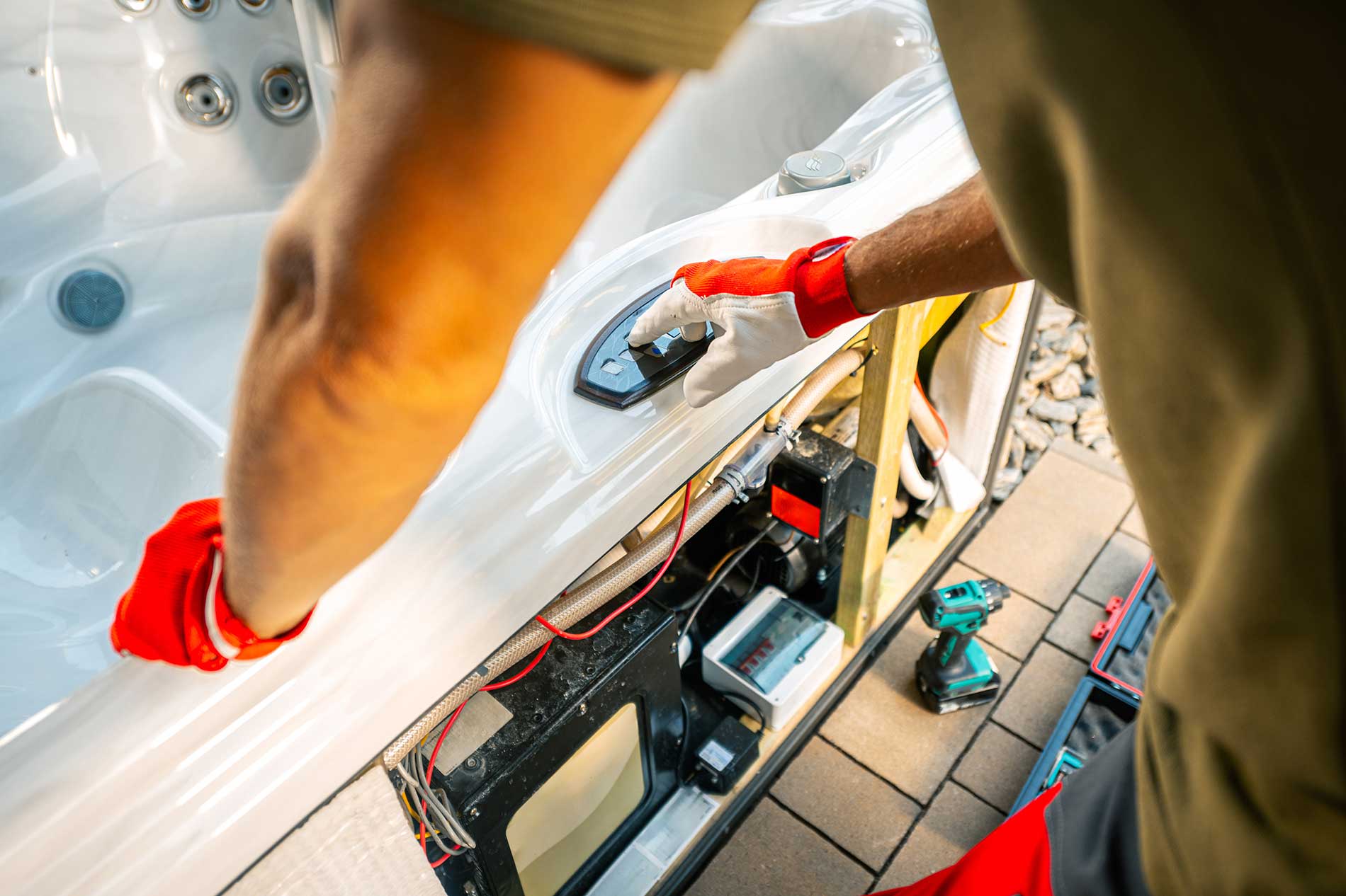 Technician-Repairs-Hot-Tub-Controls-in-Backyard-Oasis-While-Ensuring-Optimal-Function-and-Safety