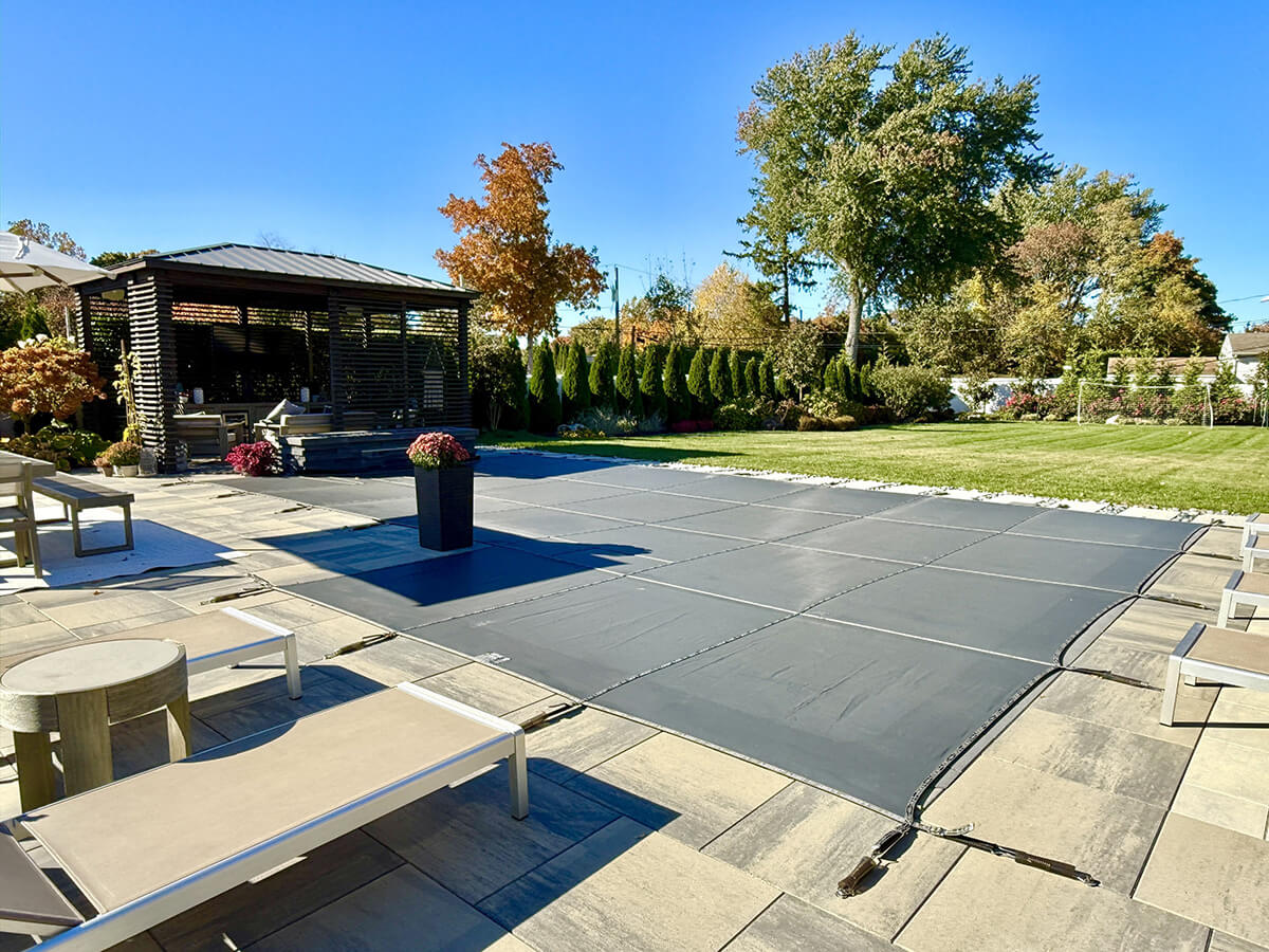 inground pool with safety mesh cover